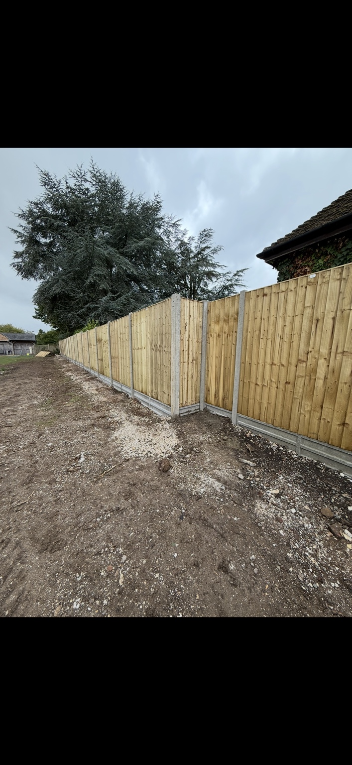 Timber panel fencing with concrete posts and gravel boards by Cartwright Fencing Company